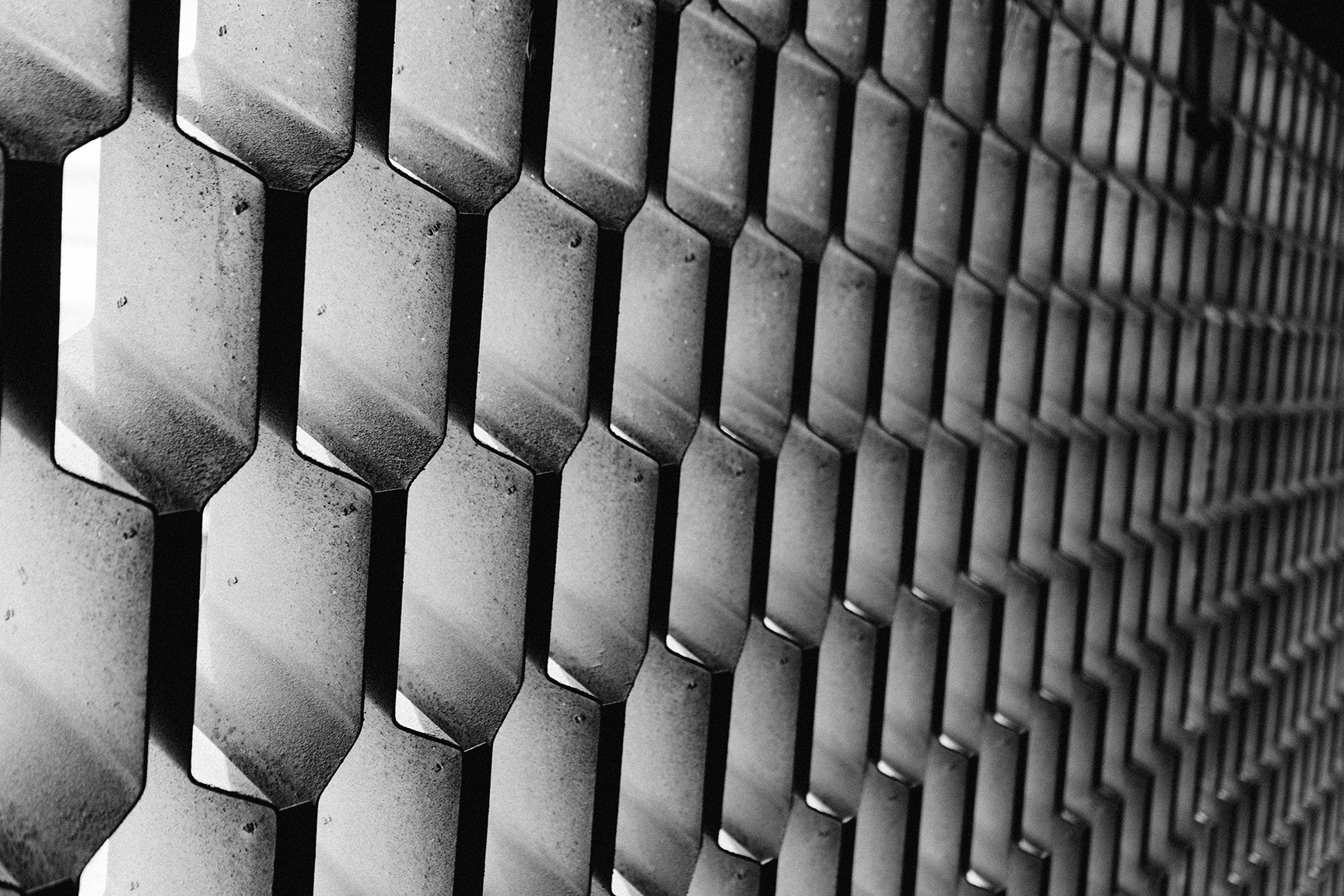 Grayscale Photography of Metal Cutout Wall